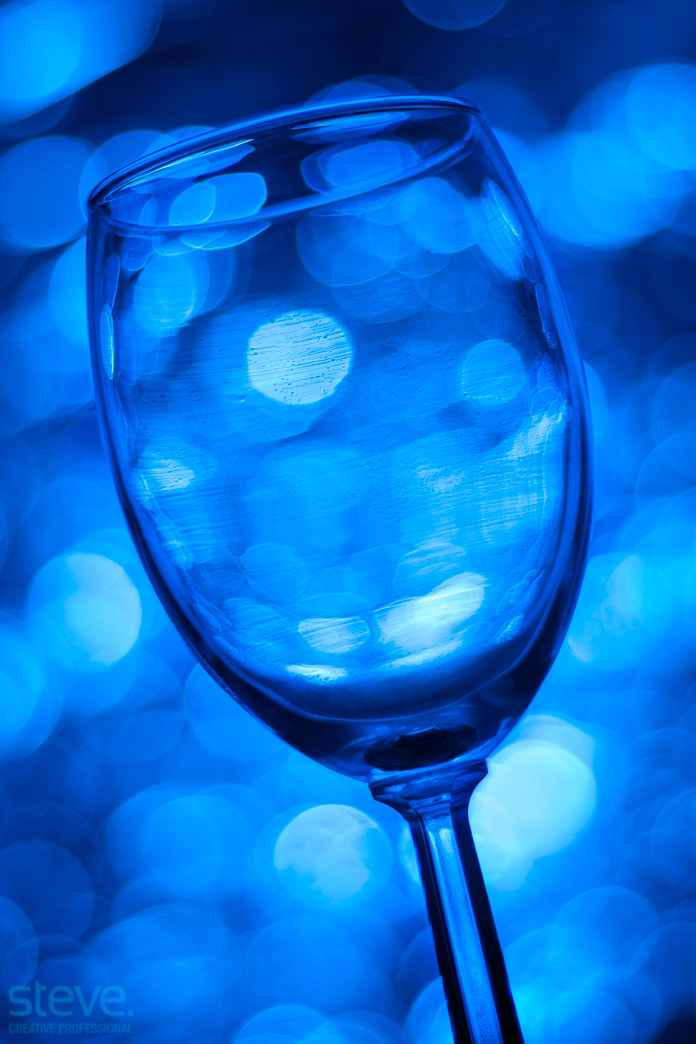 Wine glass on blue background